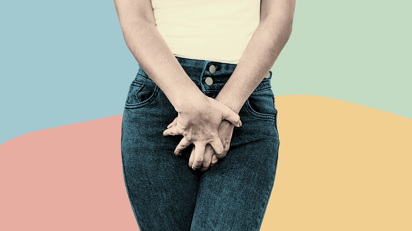 woman holding crotch in pain