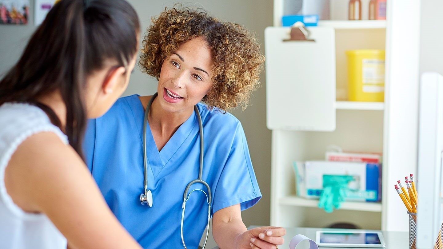 a woman talking to her doctor